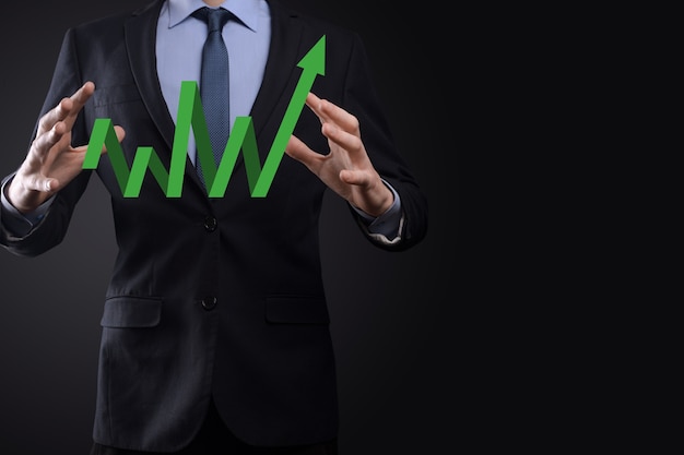 Businessman hold drawing on screen growing graph, arrow of positive growth icon.