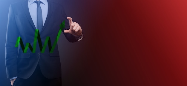 Businessman hold drawing on screen growing graph