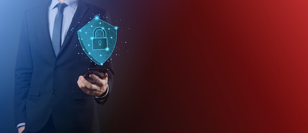 Businessman hold low poly polygon shield with a padlock\
icon.secure access system concept.business financial warranty for\
investment.antivirus concept.technology security.protection\
network,safe data.