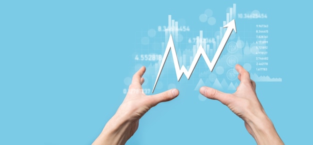 Businessman hold sales data and economic growth graph chart. Business planning and strategy. Analysing trading of exchange. Financial and banking. Technology digital marketing.Profit and growing plan.