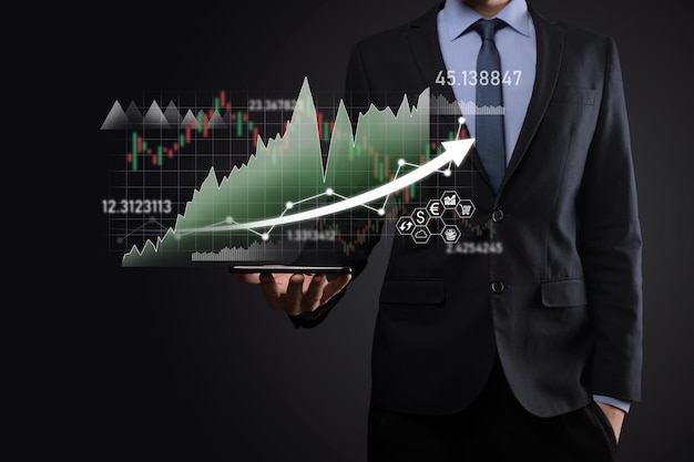 Businessman hold sales data and economic growth graph chart. Business planning and strategy. Analysing trading of exchange. Financial and banking. Technology digital marketing.Profit and growing plan.