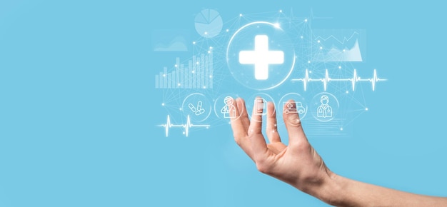 Businessman hold virtual plus medical network connection icons. Covid-19 pandemic develop people awareness and spread attention on their healthcare.Doctor,document,medicine,ambulance,patient icon.