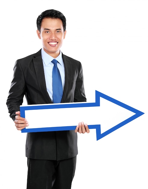 Businessman holding arrow in hand