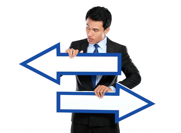 Businessman holding arrow in hand