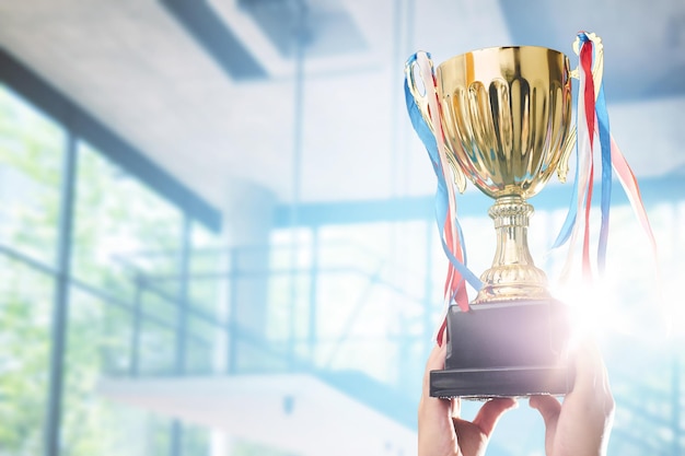 Photo businessman holding award trophy for show their victory