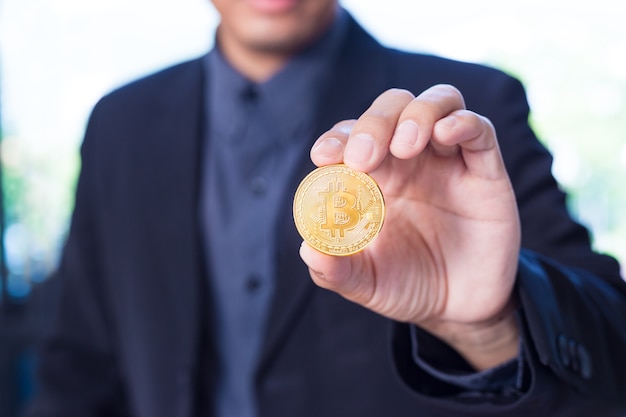 Businessman holding a Bitcoin