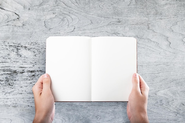 Businessman holding blank book