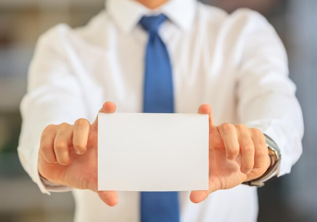 Businessman holding a blank card