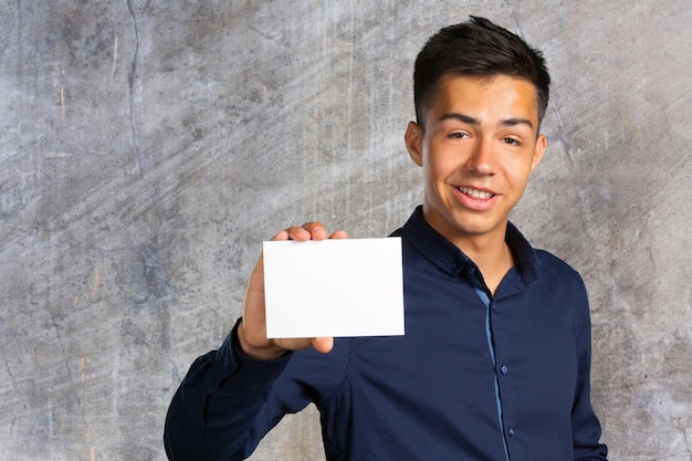 businessman holding a blank signboard