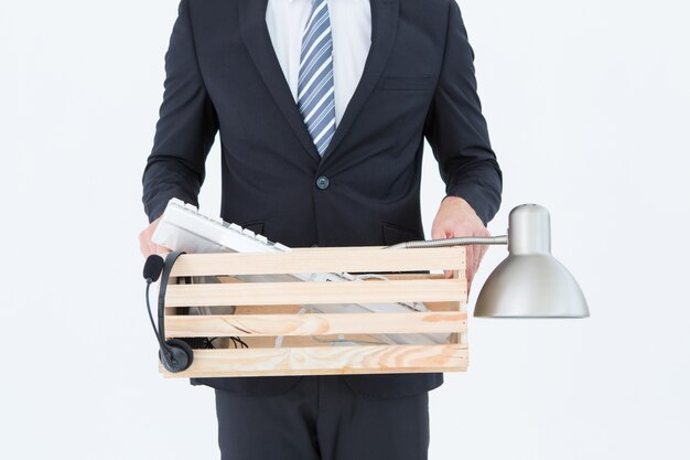 Businessman holding box of his things