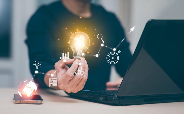 Photo businessman holding a bright light bulb, creativity with light bulbs and energy power, hand of a man with a light bulb and line light icon and using a notebook computer, technology innovation idea