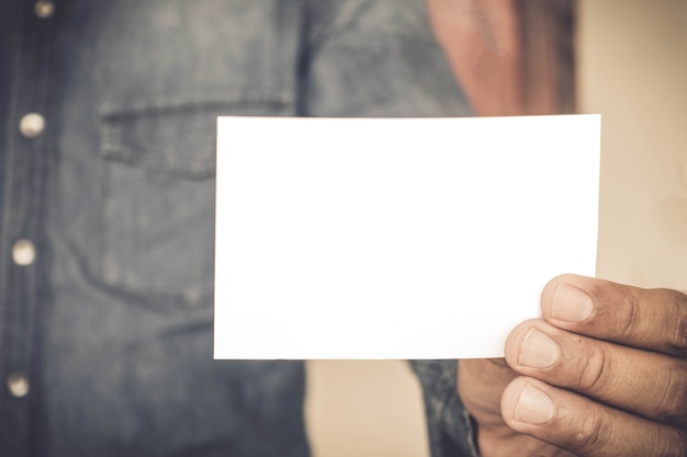 Businessman holding a business card.