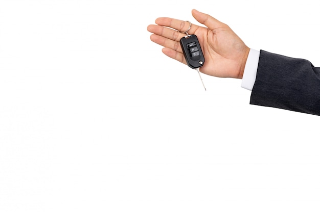 A businessman holding a car key