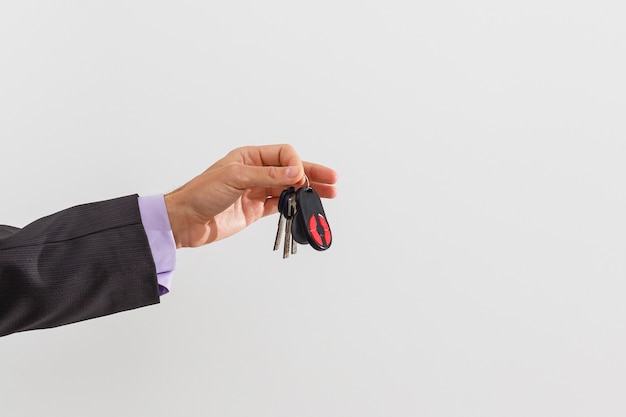 businessman holding a car key