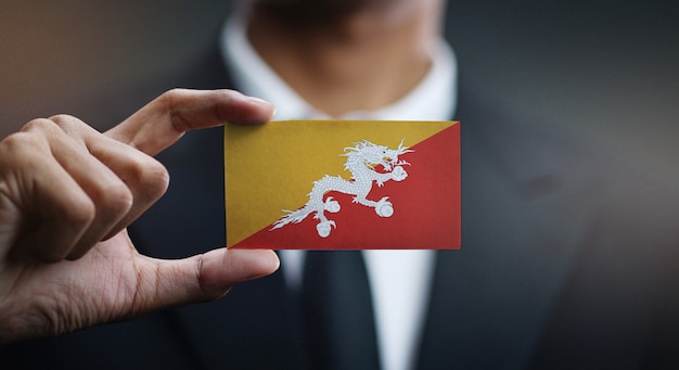 Businessman Holding Card of Bhutan Flag