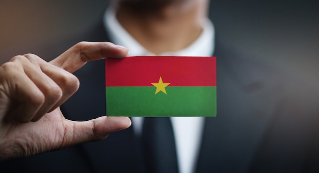 Businessman Holding Card of Burkina Faso Flag