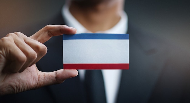 Businessman Holding Card of Crimea Flag