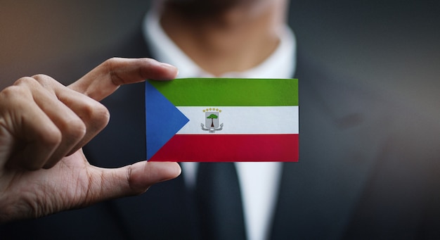 Businessman Holding Card of Equatorial Guinea Flag