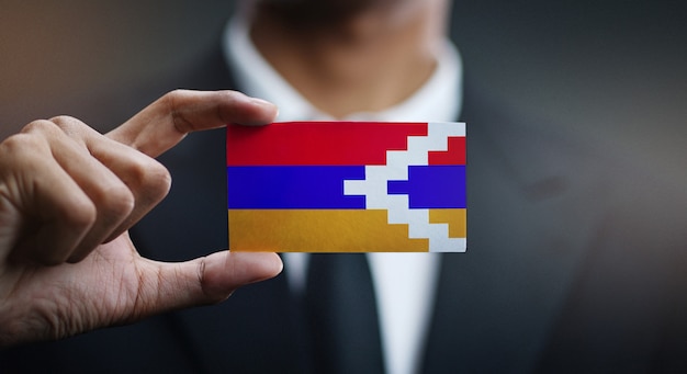 Businessman Holding Card of Nagorno-Karabakh Republic Flag