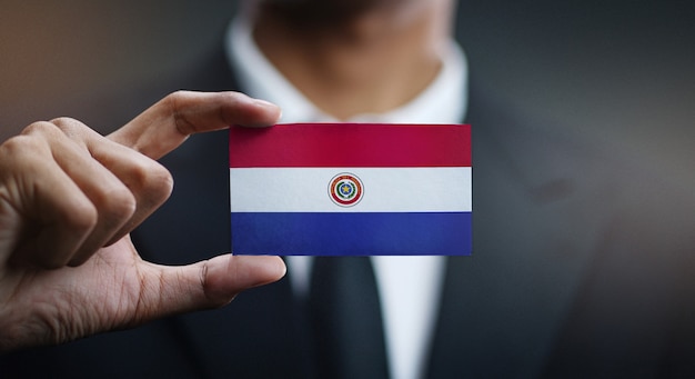 Businessman Holding Card Paraguay Flag