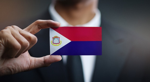 Businessman Holding Card of Saint Martin Flag