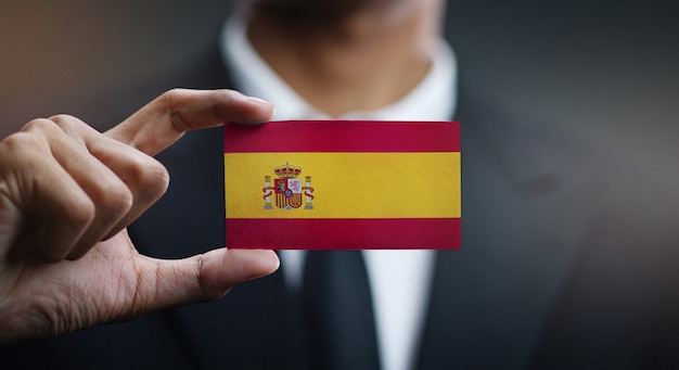 Businessman Holding Card of Spain Flag 