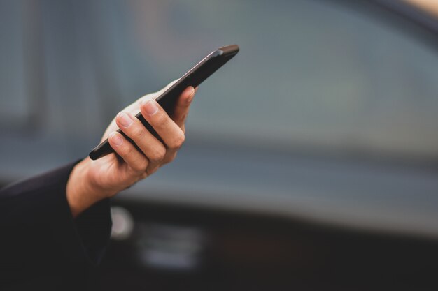 Businessman holding cell phone