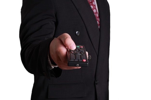 businessman holding and clicking remote control front view isolated on white