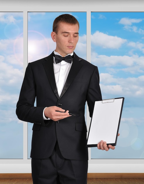 Businessman holding clipboard