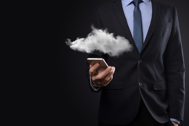 Businessman holding cloud