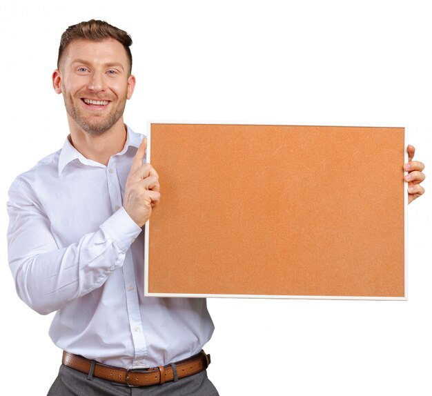 Businessman holding a corkboard 