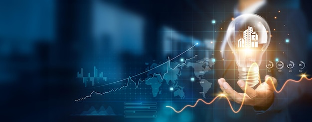 Businessman holding creative light bulb with growth graph and smart city icons Leveraging innovation