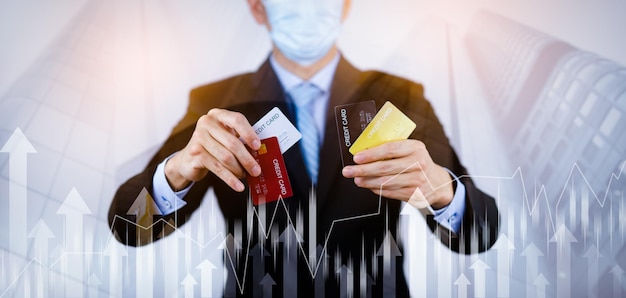 Businessman holding credit card for makes a purchase on the Internet on the laptop computer with credit card, online payment, shopping online, e-commerce, internet banking, spending money concept.