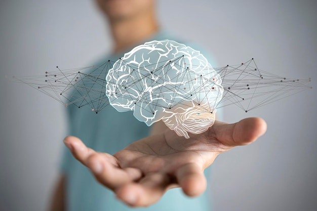 Businessman holding digital human brain with cell