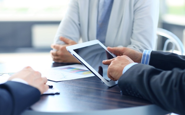 Businessman holding digital tablet in office