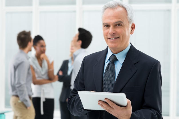 Businessman Holding Digital Tablet