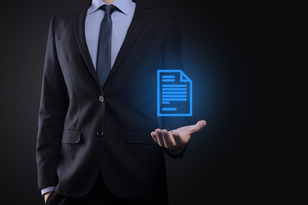 Businessman holding a document icon in his hand