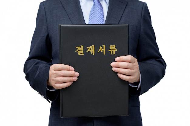 A businessman holding the file for approval