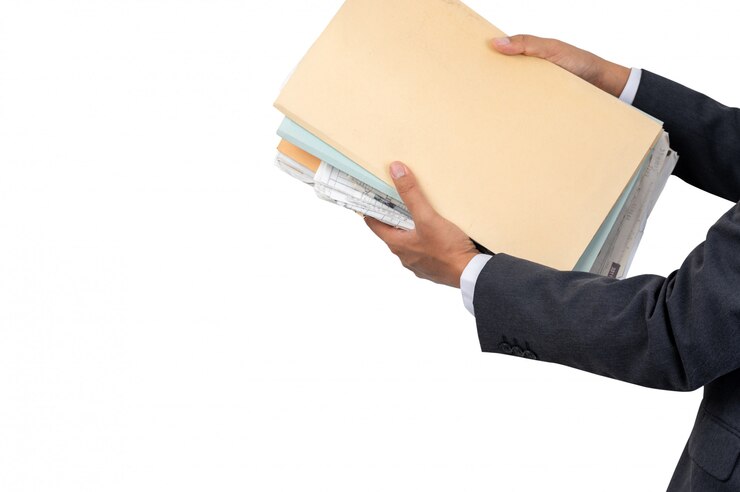 A businessman holding a file