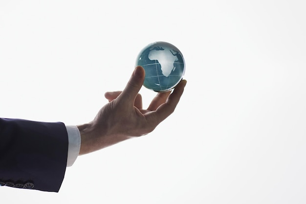 Businessman holding a globe earth planet with a map isolated on white background