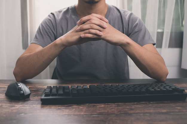 Businessman holding hands, thinking about solving work problems