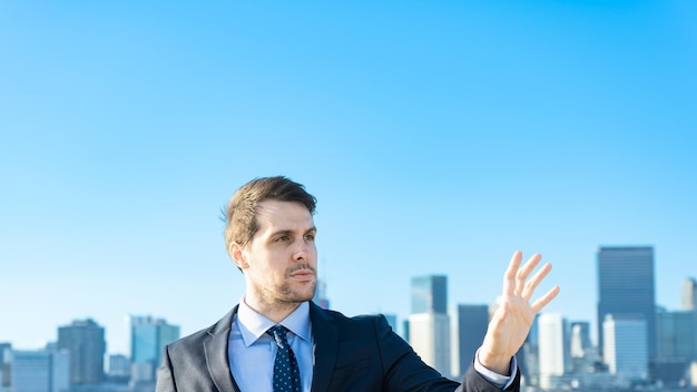 A businessman holding his hand and cityscape