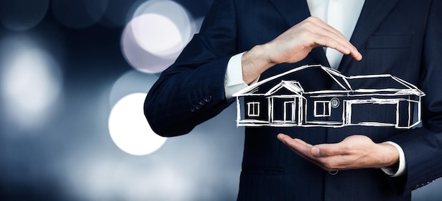 businessman holding a house icon Real estate, investment and finance concepts