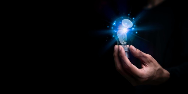 Businessman holding a light bulb creative new idea innovation\
brainstorming solution and inspiration concepts imagination\
creative thinking problem solvingx9