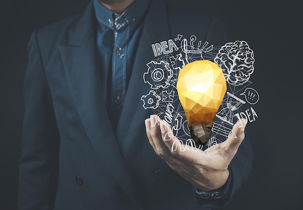 Businessman holding a light bulb giving ideas ideas information news and trading stocks concept