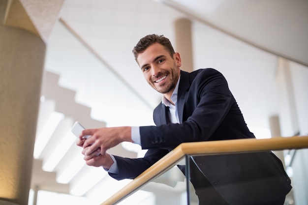 Businessman holding mobile phone