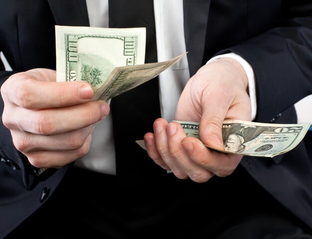 Businessman holding money in his hands