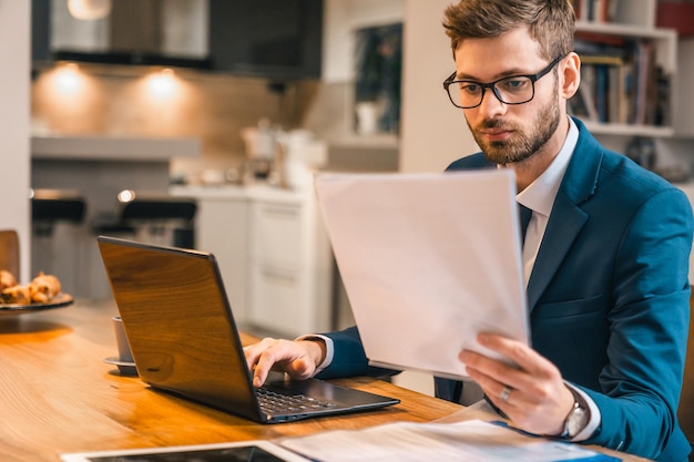 businessman holding papers