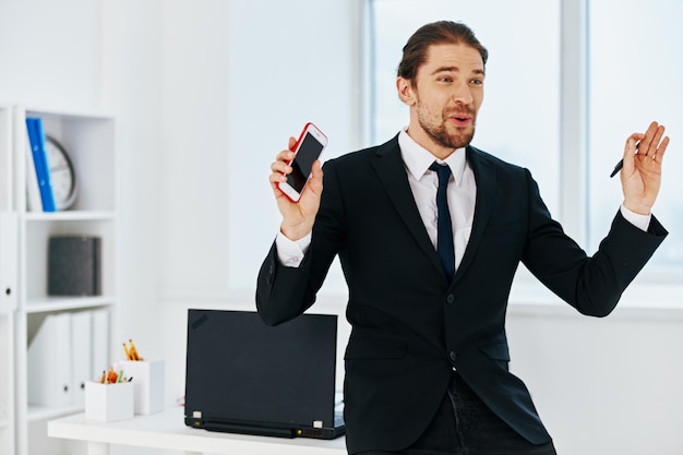 Businessman holding a phone telephone office technologies