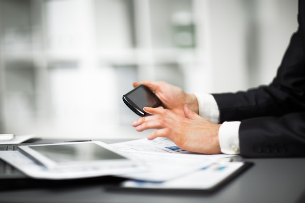 Businessman holding a phone